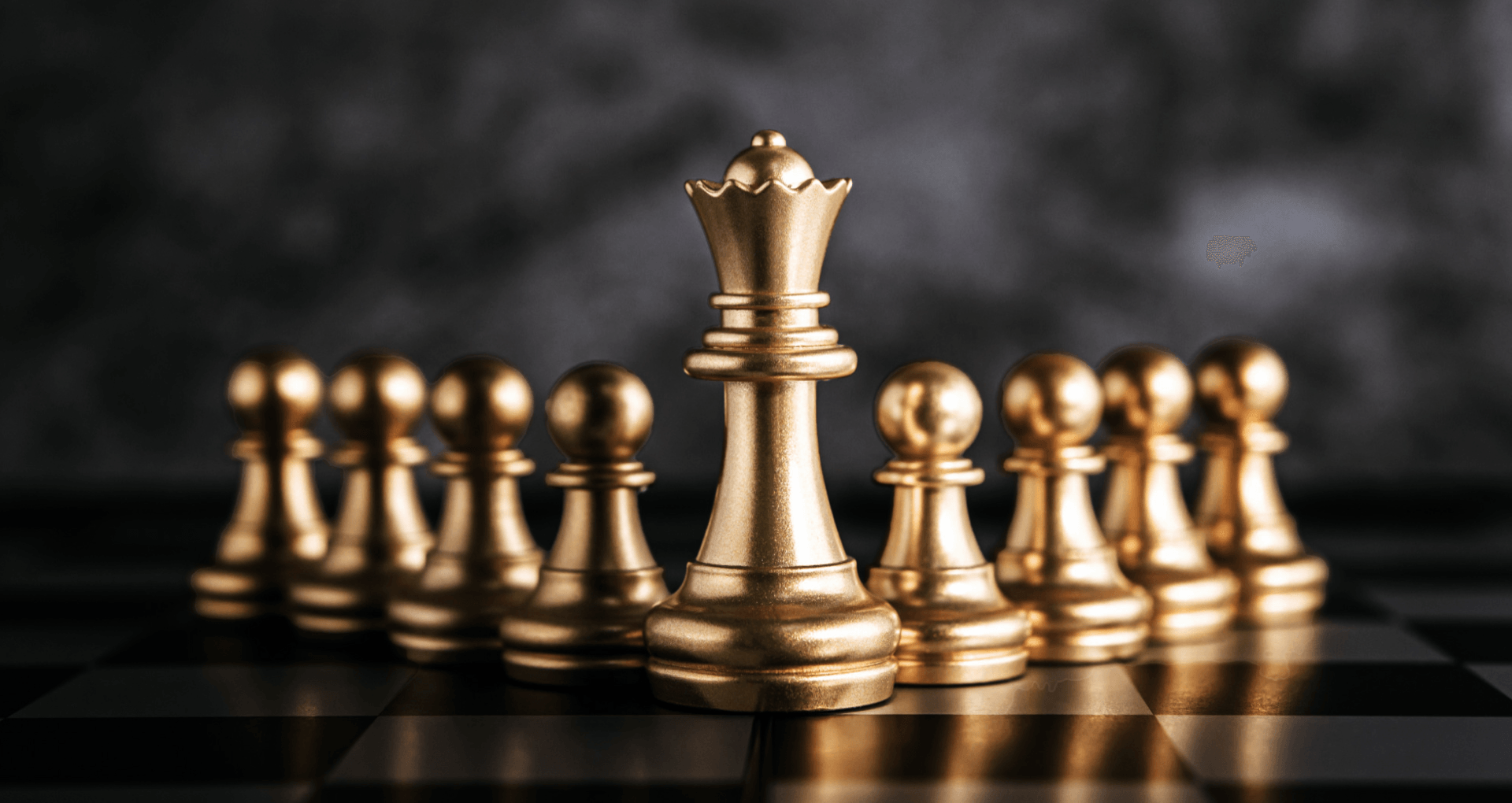Gold chess pieces symbolizing Frameboxx leadership and strategy
